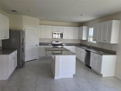 561 Talisi Loop, Saint Cloud, FL 34771 - photo 2