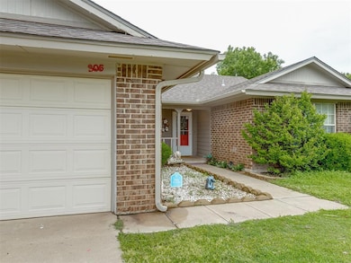Property entrance featuring an attached garage, a 