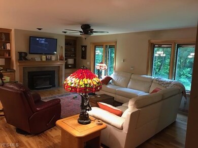 The masonary fireplace includes an insert which ca
