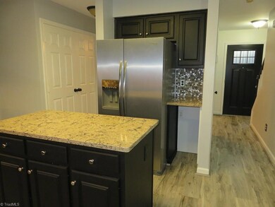 Kitchen view toward front entry