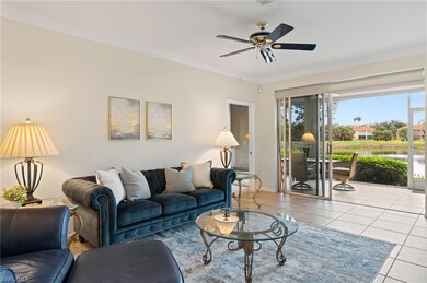 Living room with ceiling fan, light tile patterned
