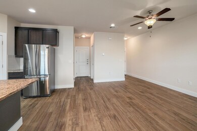 Kitchen with freestanding refrigerator, recessed 