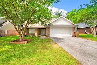 View of front of home featuring concrete driveway,