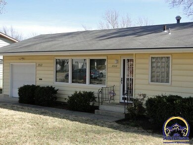 Vinyl Siding, One car garage and an attached Carport