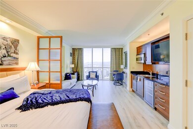 Bedroom with light wood-style floors, crown moldin