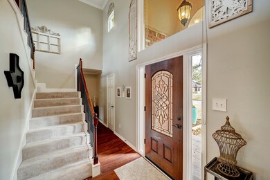 A charming covered front porch and decorative beveled glass front door will welcome you inside to the foyer, where you will be greeted with gleaming engineered wood floors, soaring 2-story ceilings, and unbeatable natural light.