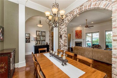 Brick arches and triple crown molding define the f