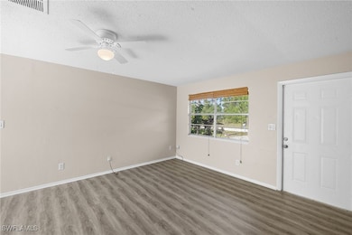 Livingroom featuring wood finished floors, ceiling