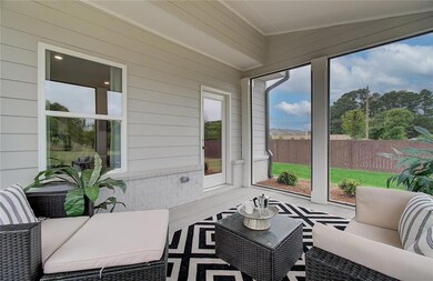 Sunroom / solarium featuring an outdoor hangout ar