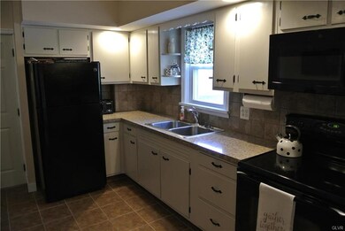 Open updated kitchen with recently added soffits, 