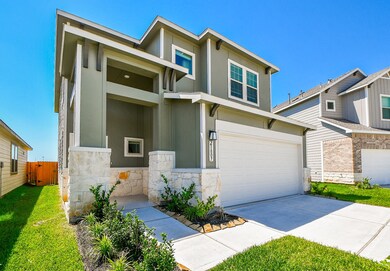 The spacious two-car garage and long driveway offe