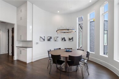 Dining room featuring baseboards, dark wood-style 