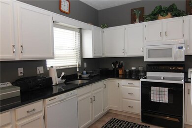 Updated, kitchen with some new lighting, granite counter tops, new sink and fixtures and ceramic tile flooring. Nice size!!