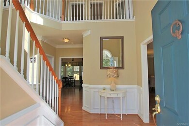 Beautiful  two story foyer with hardwood floors an