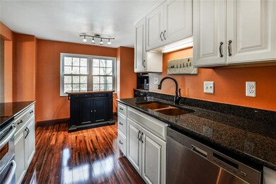 Beautiful kitchen with granite counters, a copper 