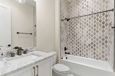 Full bathroom right next the first floor bedroom and right before the kitchen