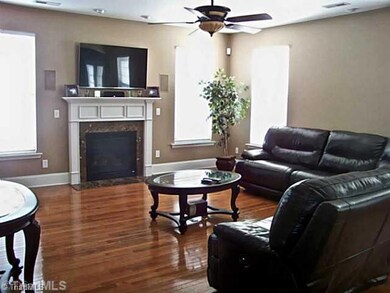 Living Room. Gas log fireplace, surround sound and gleaming wood floors say, 