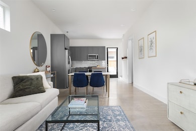 Living room with baseboards and recessed lighting