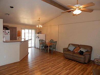 Living Room. Nice ceiling fan, and open concept.