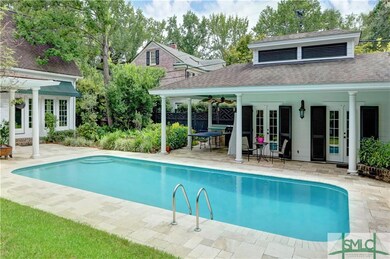 Pool view with pool house