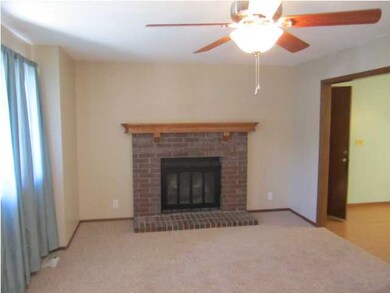 Living room with lots of light and fireplace