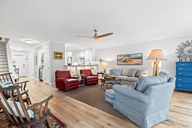 Living room with baseboards, ceiling fan, ornament
