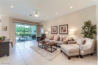 Living room featuring ceiling fan, ornamental mold