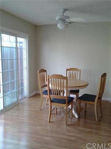Newer laminate flooring throughout living room, di
