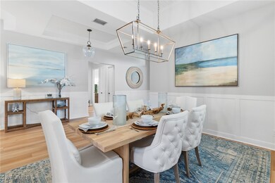 Dining Room with decorative wall panels, chandelie