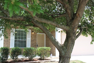 View of property hidden behind natural elements f
