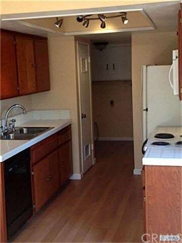 Super clean kitchen and full sized laundry room.