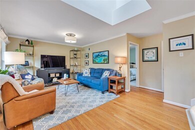 Beautiful woods floors and sky lights great you as you walk in!