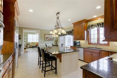 Kitchen- cherry cabinets, expansive island