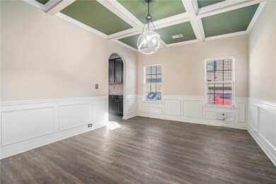 Dining room with a chandelier, beam ceiling, dark 