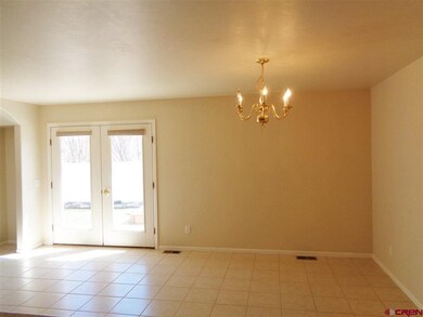 French doors open to patio and back yard