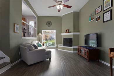 Dedicated living area with feature fireplace and natural light!
