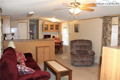 Enter into the living room with dining and kitchen