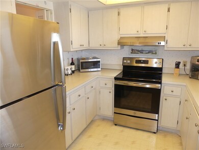 KITCHEN WITH NUMEROUS CABINETS AND SS APPLIANCES