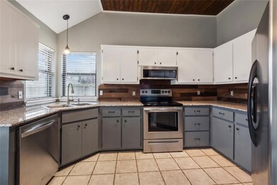 Kitchen with a sink, stainless steel appliances, l
