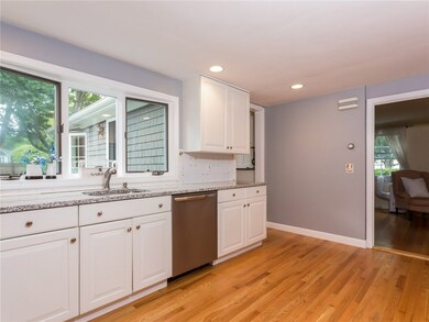 Kitchen with window overlooking back patio/yard