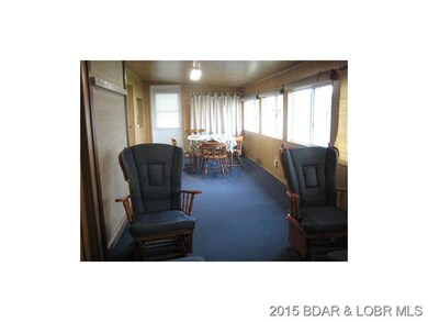 Murphy bed hehind blue rocker