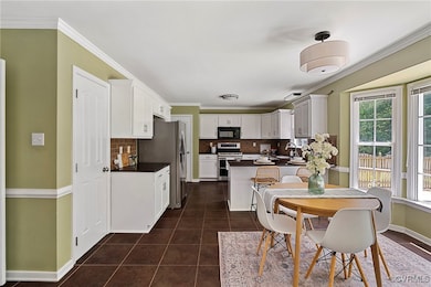 Tile floor and subway tile backsplash in the kitch