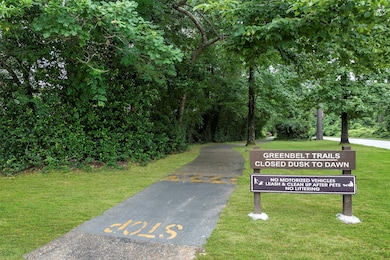 Trail entrance, ideal for outdoor enthusiasts. The