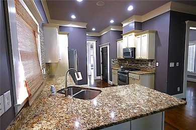 Kitchen with recessed lighting, stainless steel ap