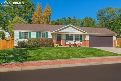 Park-like lawn with mature trees and landscaping.