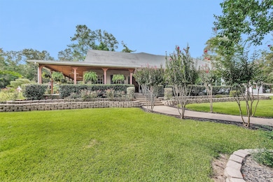 Gorgeous, meticulously maintained landscaping surrounds the home, complemented by a charming wraparound porch perfect for taking in the serene views.