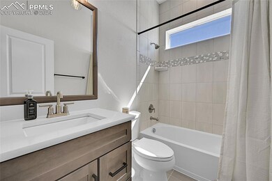 Full bathroom with toilet, tile floors, shower / b