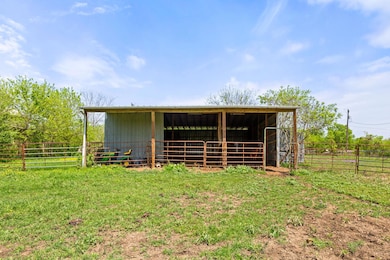 View of outdoor structure featuring an outbuildin