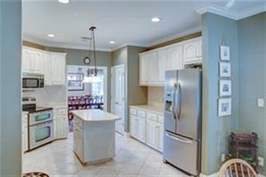 Light and airy Kitchen has stainless steel applian
