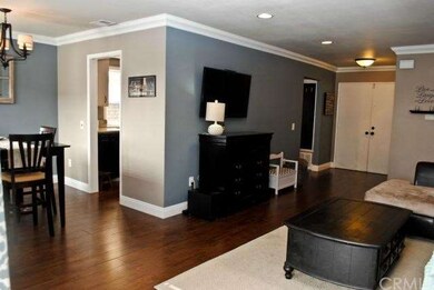 This shot shows the entry, living room, dining roo